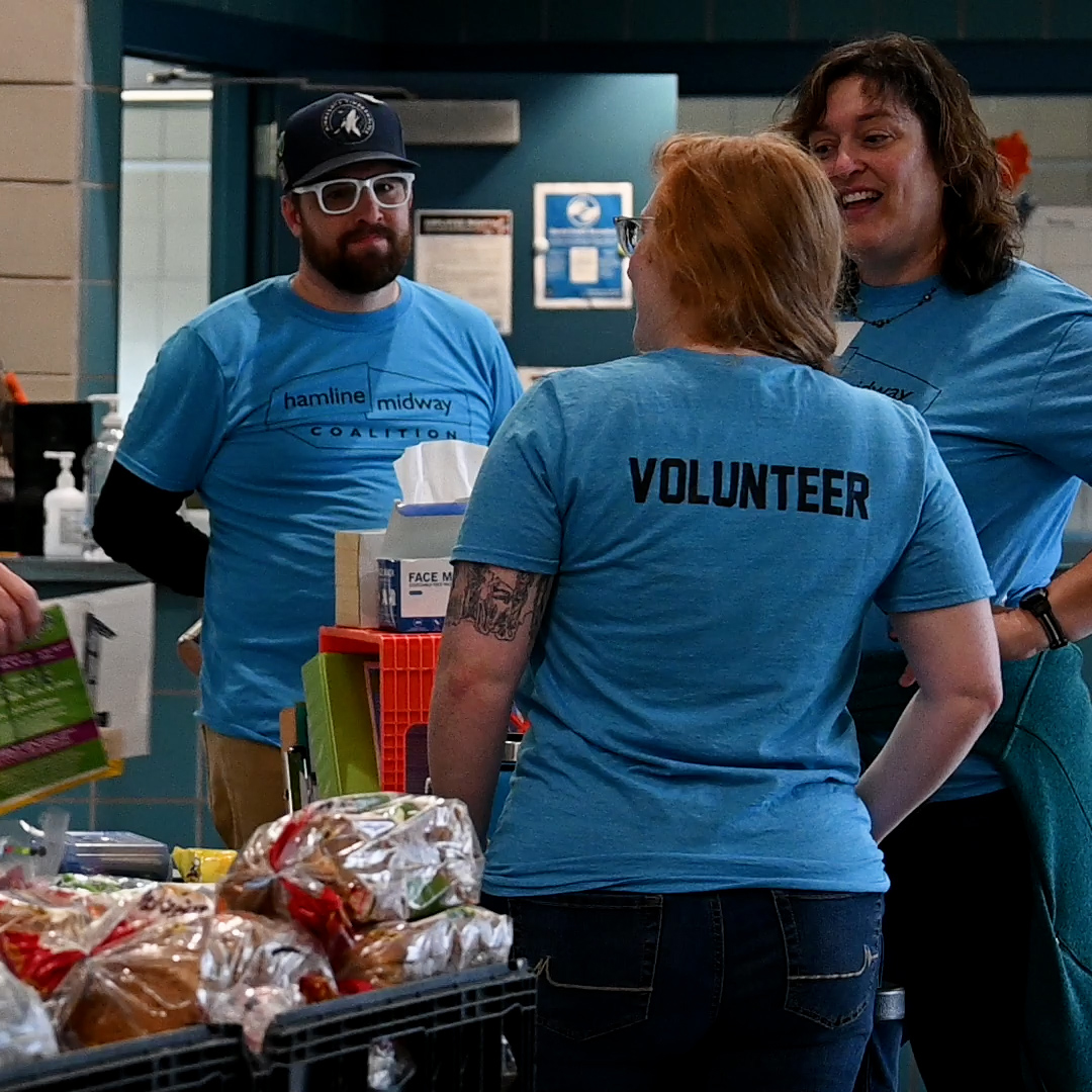 Picture of volunteers at weekly food distribution for the Midway Project